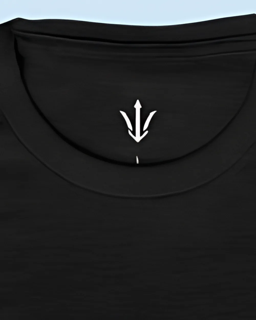 Close-up of the black tee collar and the printed trident neck label
