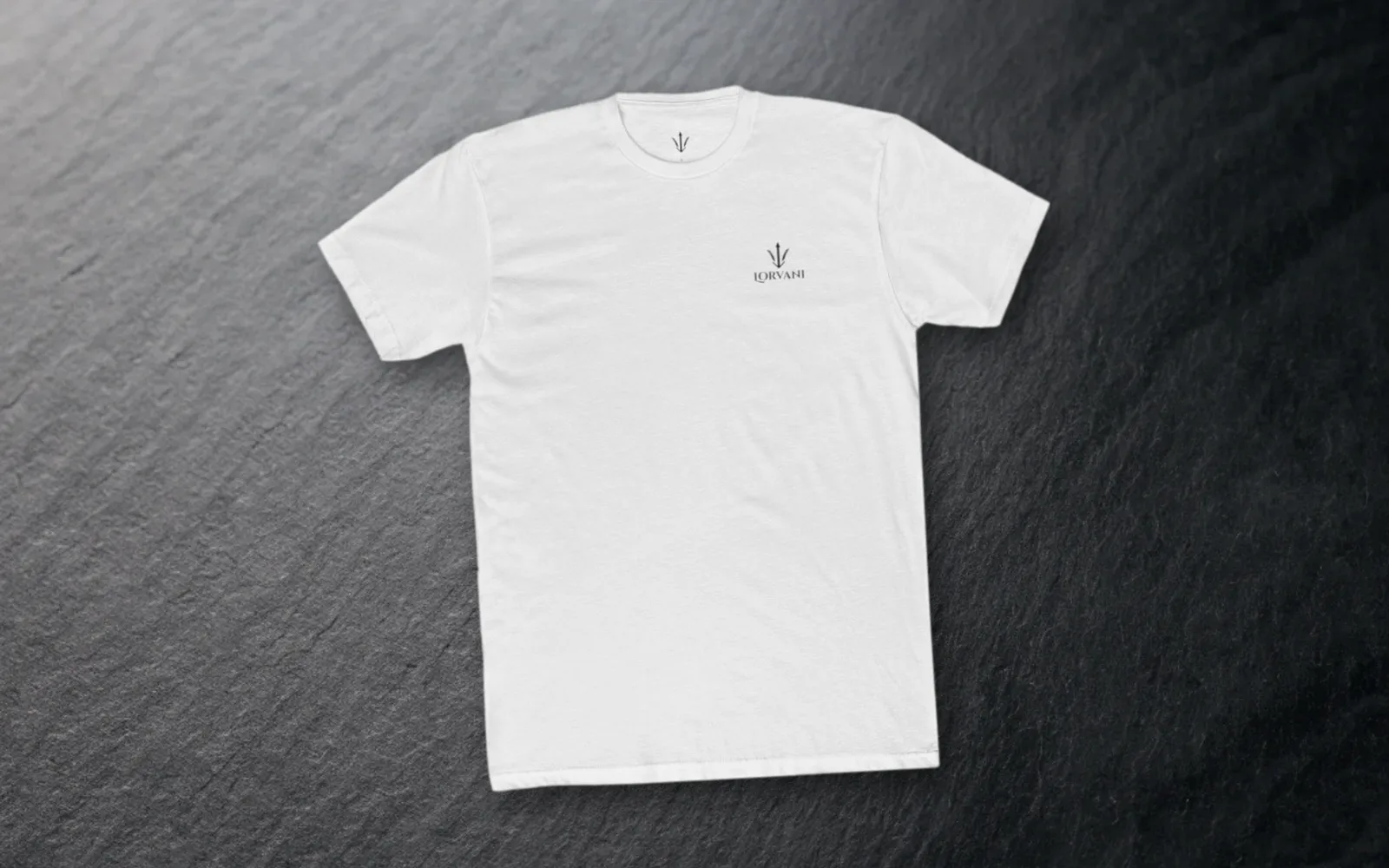 The white tee laid flat on grey slate